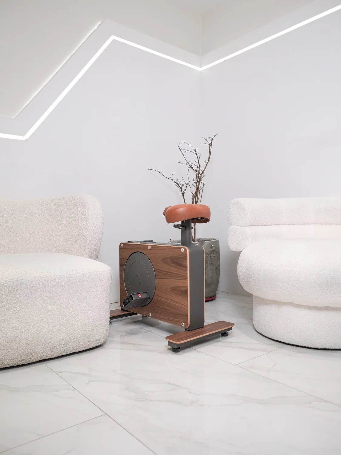 Cube Cycle between white chairs in a bright Philippine living room